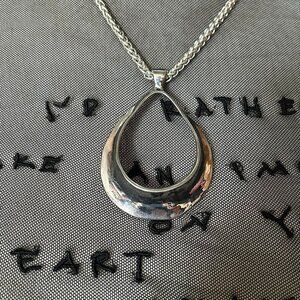 Silver curved organic abstract pendant necklace